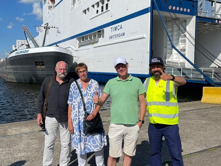 Pol, Nikki, Arnout and Joris from CptnZeppos in front of the ship Timca going from Antwerp, Belgium to Finland and back